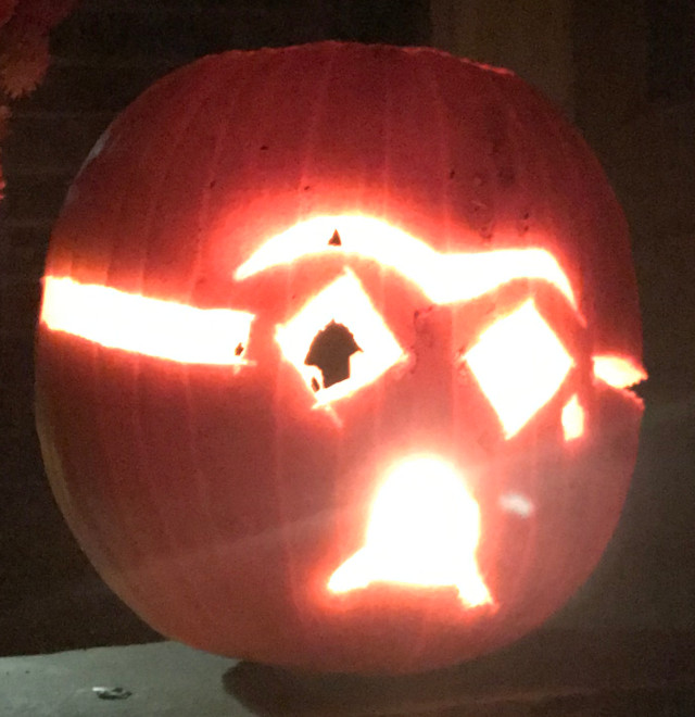 image of some carved pumpkin jack-o-lanterns during the night